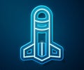 Glowing neon line Rocket icon isolated on blue background. Vector Royalty Free Stock Photo