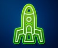 Glowing neon line Rocket ship icon isolated on blue background. Space travel. Vector Royalty Free Stock Photo