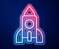 Glowing neon line Rocket ship toy icon isolated on blue background. Space travel. Vector Royalty Free Stock Photo