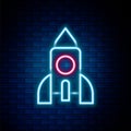 Glowing neon line Rocket ship toy icon isolated on brick wall background. Space travel. Colorful outline concept. Vector Royalty Free Stock Photo