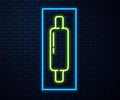 Glowing neon line Rolling pin icon isolated on brick wall background. Vector Illustration