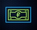 Glowing neon line Russian ruble banknote icon isolated on brick wall background. Vector