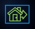 Glowing neon line Sale house icon isolated on brick wall background. Buy house concept. Home loan concept, rent, buying Royalty Free Stock Photo