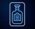 Glowing neon line Sauce bottle icon isolated on brick wall background. Ketchup, mustard and mayonnaise bottles with sauce for fast Royalty Free Stock Photo