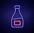 Glowing neon line Sauce bottle icon isolated on brick wall background. Ketchup, mustard and mayonnaise bottles with Royalty Free Stock Photo