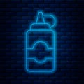 Glowing neon line Sauce bottle icon isolated on brick wall background. Ketchup, mustard and mayonnaise bottles with Royalty Free Stock Photo