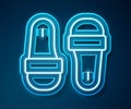 Glowing neon line Sauna slippers icon isolated on blue background. Vector