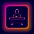 Glowing neon line Schoolboy sitting at desk icon isolated on black background. Colorful outline concept. Vector