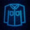 Glowing neon line Shirt icon isolated on brick wall background. Vector