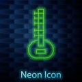 Glowing neon line Sitar classical music instrument icon isolated on brick wall background. Vector