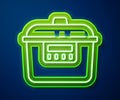 Glowing neon line Slow cooker icon isolated on blue background. Electric pan. Vector