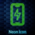 Glowing neon line Smartphone charging battery icon isolated on brick wall background. Phone with a low battery charge Royalty Free Stock Photo