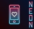 Glowing neon line Smartphone with heart emoji speech bubble get message on screen icon isolated on black background. Valentines Royalty Free Stock Photo