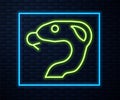 Glowing neon line Snake icon isolated on brick wall background. Vector