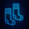 Glowing neon line Socks icon isolated on brick wall background. Vector Royalty Free Stock Photo