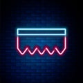 Glowing neon line Sponge with bubbles icon isolated on brick wall background. Wisp of bast for washing dishes. Cleaning