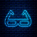 Glowing neon line Sport cycling sunglasses icon isolated on brick wall background. Sport glasses icon. Vector Royalty Free Stock Photo