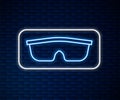 Glowing neon line Sport cycling sunglasses icon isolated on brick wall background. Sport glasses icon. Vector Royalty Free Stock Photo