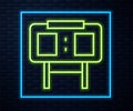 Glowing neon line Sport mechanical scoreboard and result display icon isolated on brick wall background. Vector Royalty Free Stock Photo