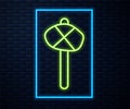 Glowing neon line Stone age hammer icon isolated on brick wall background. Vector