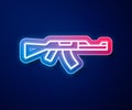 Glowing neon line Submachine gun icon isolated on blue background. Kalashnikov or AK47. Vector