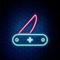 Glowing neon line Swiss army knife icon isolated on brick wall background. Multi-tool, multipurpose penknife