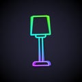 Glowing neon line Table lamp icon isolated on black background. Vector