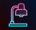 Glowing neon line Table lamp icon isolated on black background. Vector