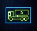 Glowing neon line Tanker truck icon isolated on brick wall background. Petroleum tanker, petrol truck, cistern, oil