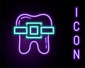 Glowing neon line Teeth with braces icon isolated on black background. Alignment of bite of teeth, dental row with with