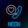 Glowing neon line Telephone with heart emoji speech bubble get message on screen icon isolated on black background Royalty Free Stock Photo