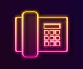 Glowing neon line Telephone icon isolated on black background. Landline phone. Vector