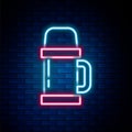 Glowing neon line Thermos container icon isolated on brick wall background. Thermo flask icon. Camping and hiking