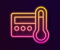 Glowing neon line Thermostat icon isolated on black background. Temperature control. Vector
