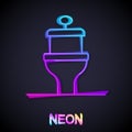 Glowing neon line Toilet bowl icon isolated on black background. Vector