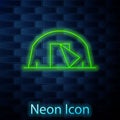 Glowing neon line Tourist tent icon isolated on brick wall background. Camping symbol. Vector