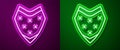 Glowing neon line Traditional mexican poncho clothing icon isolated on purple and green background. Vector