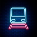 Glowing neon line Train icon isolated on brick wall background. Public transportation symbol. Subway train transport Royalty Free Stock Photo