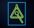 Glowing neon line Triangle musical instrument icon isolated on brick wall background. Vector Royalty Free Stock Photo