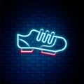 Glowing neon line Triathlon cycling shoes icon isolated on brick wall background. Sport shoes, bicycle shoes. Colorful Royalty Free Stock Photo