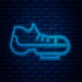 Glowing neon line Triathlon cycling shoes icon isolated on brick wall background. Sport shoes, bicycle shoes. Vector Royalty Free Stock Photo