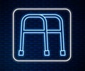 Glowing neon line Walker for disabled person icon isolated on brick wall background. Vector