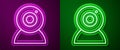 Glowing neon line Web camera icon isolated on purple and green background. Chat camera. Webcam icon. Vector