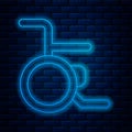 Glowing neon line Wheelchair for disabled person icon isolated on brick wall background. Vector Royalty Free Stock Photo