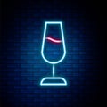 Glowing neon line Wine glass icon isolated on brick wall background. Wineglass sign. Colorful outline concept. Vector Royalty Free Stock Photo