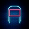 Glowing neon line Winter hat with ear flaps icon isolated on brick wall background. Colorful outline concept. Vector