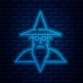 Glowing neon line Wizard warlock icon isolated on brick wall background. Vector