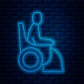 Glowing neon line Woman in wheelchair for disabled person icon isolated on brick wall background. Vector Royalty Free Stock Photo