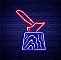 Glowing neon line Wooden axe in stump icon isolated on brick wall background. Lumberjack axe. Axe stuck in wood