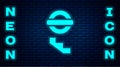 Glowing neon London underground icon isolated on brick wall background. Vector